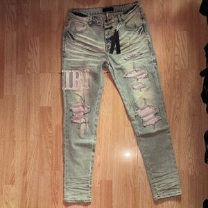 AMIRI Light Blue Skinny Jeans with Pink Patch and Embroidered Logo